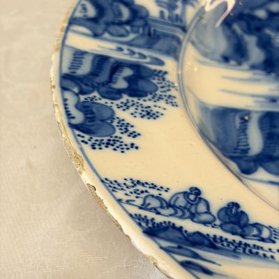 A large blue and white Dutch Delft chinoiserie dish with landscape and figural design — photo 9