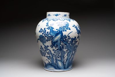 A large blue and white Dutch Delft Kangxi-style chinoiserie 'pheasant among peonies' vase, early 18th C.