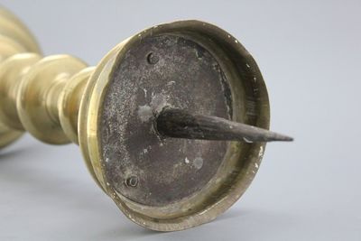 A large brass pricket candlestick, 16th C.