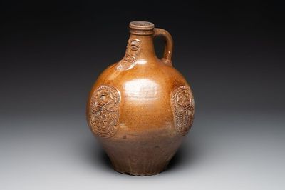 A large brown-glazed stoneware bellarmine jug, 17th C.