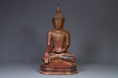 A large Burmese gilt lacquer Buddha in bhumisparsha mudra, 19/20th C.
