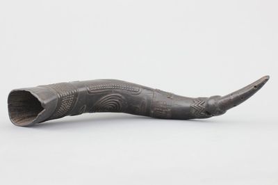 A large carved African Kuba drinking cup, carved and pierced buffalo horn, first half 20th C.