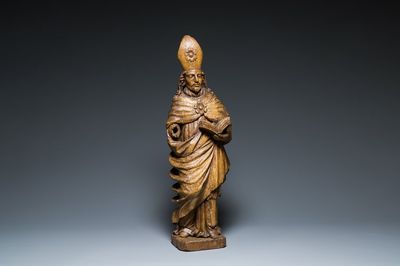 A large carved oak sculpture of a bishop, Flanders, 16th C.