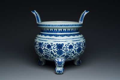 A large Chinese blue and white 'bajixiang' tripod censer with lotus scrolls, Qianlong