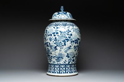 A large Chinese blue and white 'birds among blossoming branches' vase and cover, 19th C.