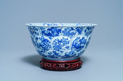 A large Chinese blue and white bowl with floral panels, Kangxi