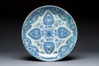 A large Chinese blue and white dish with floral design, Kangxi