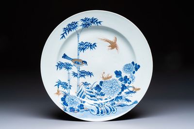A large Chinese blue and white gilt-decorated dish with birds and insects among bamboo and peonies, Yongzheng