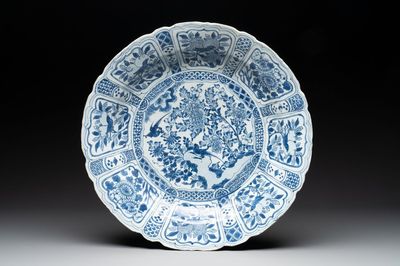 A large Chinese blue and white 'kraak' dish with birds among flowering branches, Wanli