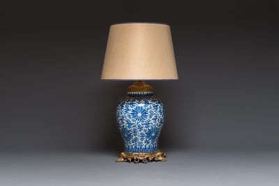A large Chinese blue and white 'Lotus Scroll' baluster vase with later gilt-bronze lamp mounts, Kangxi
