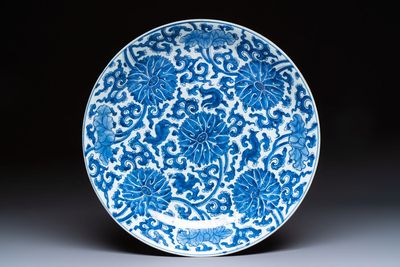 A large Chinese blue and white 'Lotus Scroll' dish, Kangxi