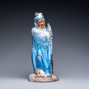 A large Chinese blue-glazed Shiwan pottery 'immortal' figure, 19th C. — photo 1
