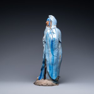 A large Chinese blue-glazed Shiwan pottery 'immortal' figure, 19th C. — photo 5