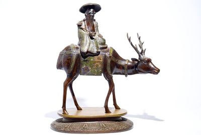 A large Chinese bronze and cloisonné model of Shou Lao on a deer, on wooden base, 19/20th C.