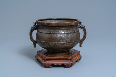 A large Chinese bronze 'Gui' vessel on hardwood stand, Yuan