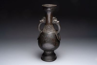 A large Chinese bronze 'hu' vase with luduan-form handles, Yuan