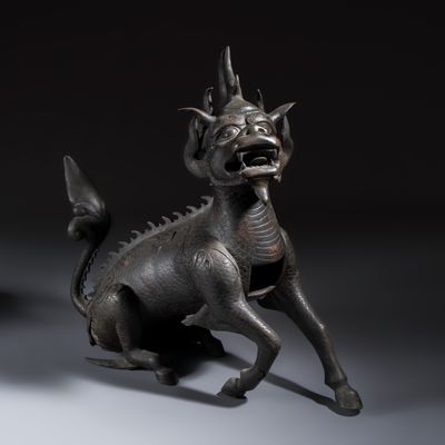 A large Chinese bronze 'Qilin' incense burner, Ming