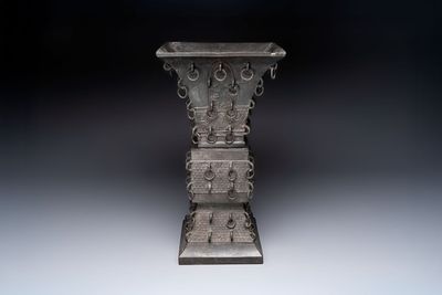 A large Chinese bronze quadrangular 'gu' vase with hanging rings, Ming
