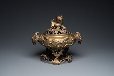 A large Chinese bronze reticulated censer and cover on stand, 19th C.