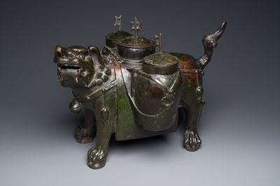 A large Chinese bronze 'touhu' or arrow vase in the shape of a lion, Ming