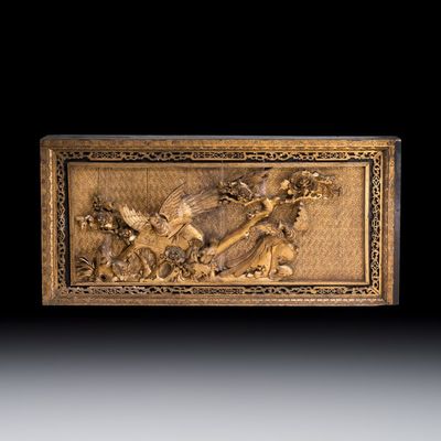 A large Chinese carved gilt wooden panel with birds among peonies, 19th C.
