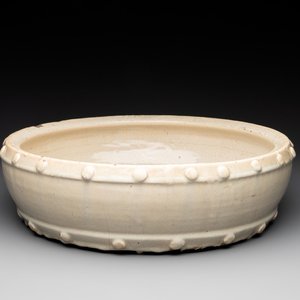A large Chinese cream-glazed drum-shaped basin, Ming — photo 1