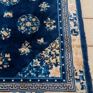 A large Chinese dark-blue-ground carpet with flowers and butterflies, 19/20th century — photo 4