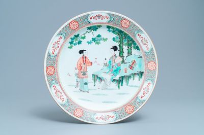 A large Chinese famille verte dish with ladies and boys in a garden, Kangxi