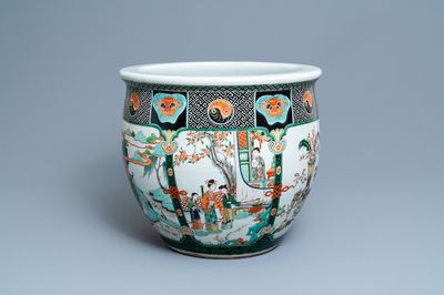 A large Chinese famille verte relief-moulded fish bowl, 19th C.