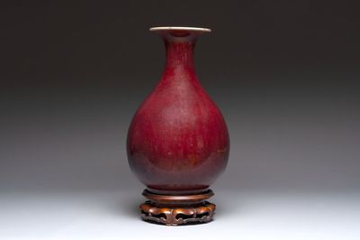 A large Chinese flambé-glazed 'yuhuchunping' vase on a wooden stand, 19th C.