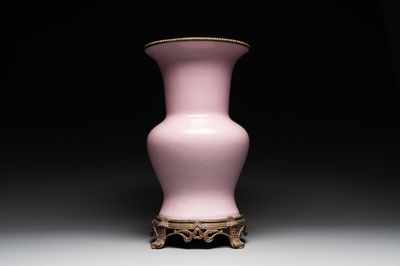 A large Chinese monochrome pink-glazed 'gu' vase with bronze mounts, 19/20th C.