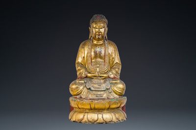 A large Chinese or Vietnamese polychromed and glit wooden Buddha, 19th C.