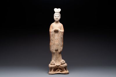 A large Chinese painted pottery figure of a civil official, Tang