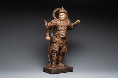 A large Chinese polychrome-lacquered wooden figure of a Guardian King, 18/19th C.