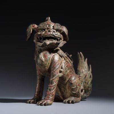 A large Chinese polychromed bronze Buddhist lion-form incense burner, probably Ming
