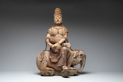 A large Chinese polychromed wooden Guanyin seated on an elephant, Republic