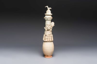 A large Chinese qingbai covered urn applied with immortals and a dragon, Northern Song