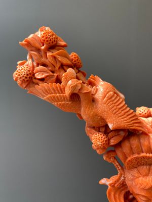 A large Chinese red coral group of a lady holding a cornucopia surrounded by children, 19/20th C. — photo 8