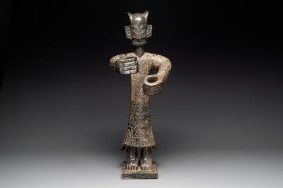A large Chinese Sanxingdui-style marble sculpture of a standing figure, 20th C.