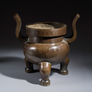 A large Chinese silver-inlaid bronze tripod censer with handles — photo 1