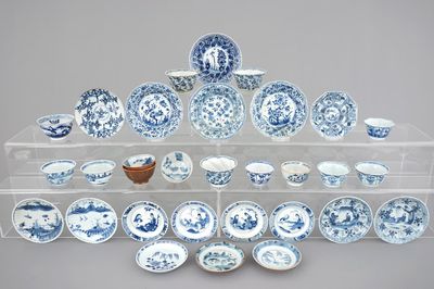 A large collection of Chinese blue and white cups and saucers, mostly Kangxi, 18th C.