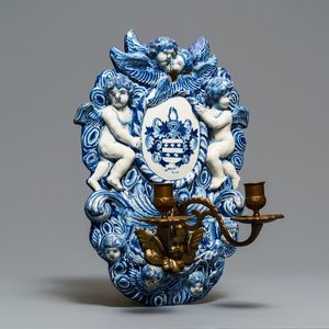A large Dutch Delft blue and white armorial relief-decorated plaque, early 18th C. — photo 1