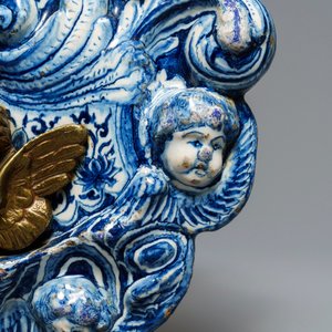 A large Dutch Delft blue and white armorial relief-decorated plaque, early 18th C. — photo 12