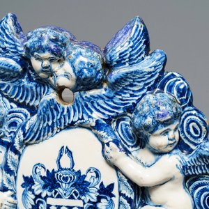 A large Dutch Delft blue and white armorial relief-decorated plaque, early 18th C. — photo 10