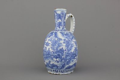 A large Dutch Delft blue and white chinoiserie jug, 17th C.