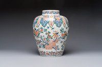 A large Dutch Delft cashmere palette vase with a phoenix and birds among flowers, ca. 1700