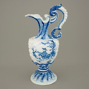 A large French faience blue and white relief-decorated jug, 18th C. — 照片 1