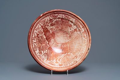 A large Hispano-Moresque lusterware charger with a bird, Valencia or Manises, Spain, 16/17th C.