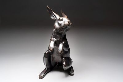 A large Japanese bronze sculpture of a sitting hare, 20th C.