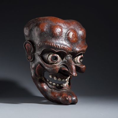 A large Japanese carved lacquered wooden mask, 19/20th C.